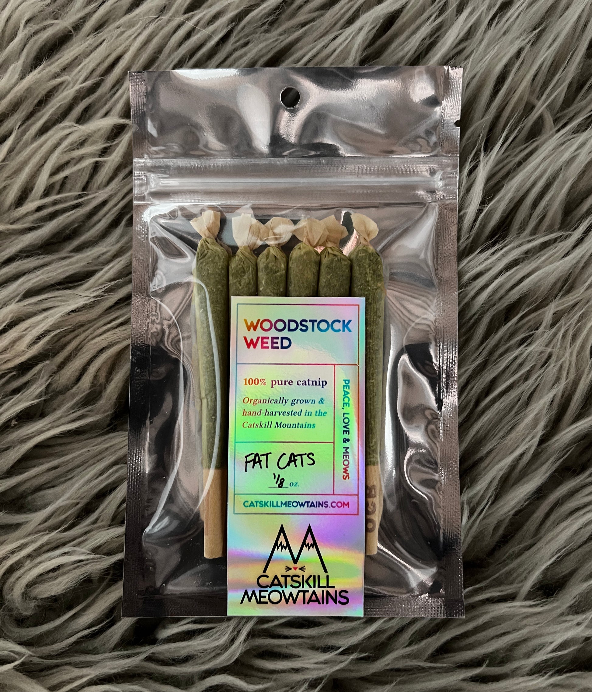 Package of Catskill Meowtains Woodstock Weed Fat Cats. Six pre-rolled catnip joints, filled with organically grown, hand-harvested catnip.